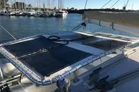 Custom CATAMARAN 12.30 M (2003) with solar panels docked in a marina.