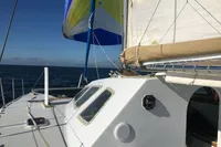 Sailing catamaran with colorful sails on open sea, Custom CATAMARAN 12.30 M, 2003 model.