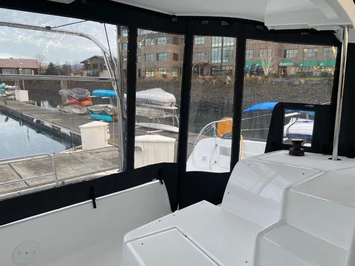  Yacht Photos Pics Interior view of 2024 Lagoon 42 catamaran at a marina.