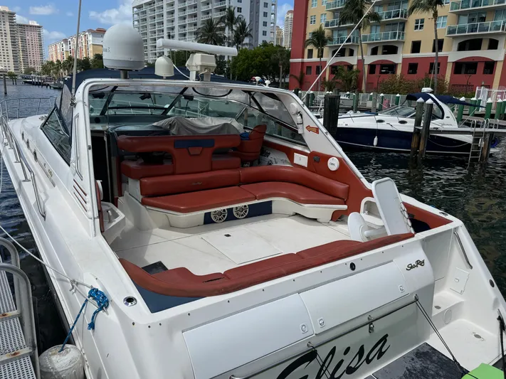  Yacht Photos Pics 1999 Sea Ray Sundancer 50 yacht docked, featuring spacious seating and modern amenities.