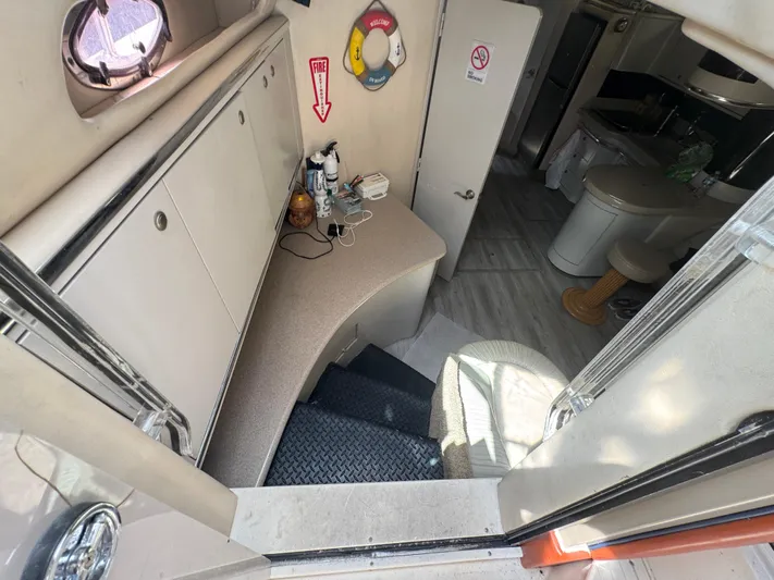  Yacht Photos Pics Interior of 1999 Sea Ray Sundancer 50 yacht, featuring stairs and compact kitchenette.