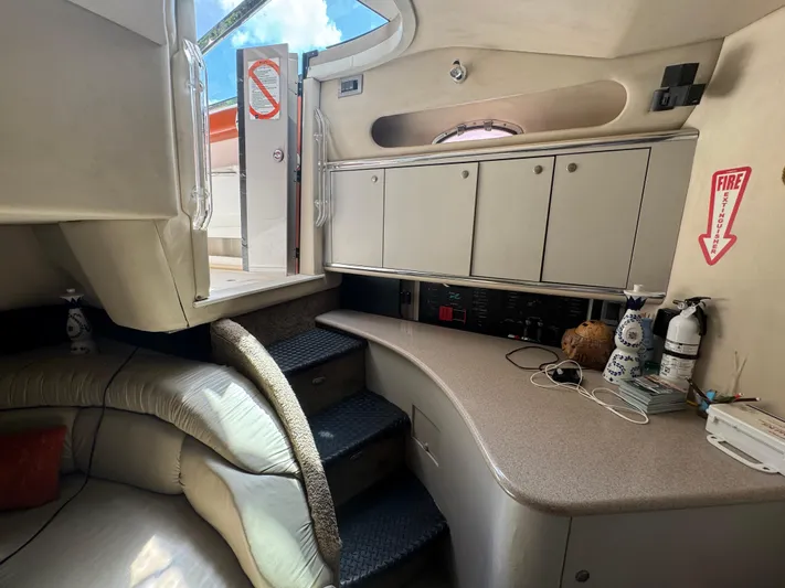  Yacht Photos Pics 1999 Sea Ray Sundancer 50 interior with cabinets, stairs, and safety equipment.