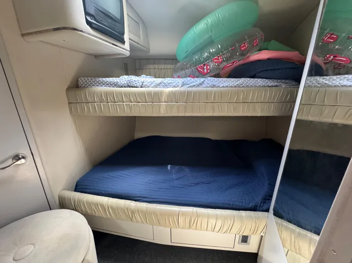  Yacht Photos Pics 1999 Sea Ray Sundancer 50 cabin with bunk beds and inflatable pool toys.