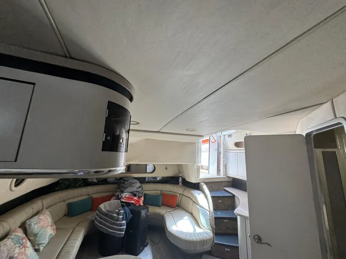  Yacht Photos Pics Interior of a 1999 Sea Ray Sundancer 50 yacht with curved seating and modern design.