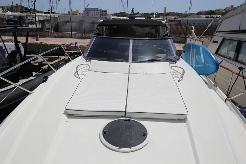  Yacht Photos Pics 2001 Sunseeker Camargue 50 yacht with sunbathing cushions on deck.