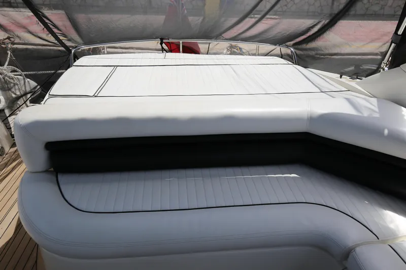  Yacht Photos Pics Luxurious Sunseeker Camargue 50 yacht interior, 2001 model, featuring sleek white seating.