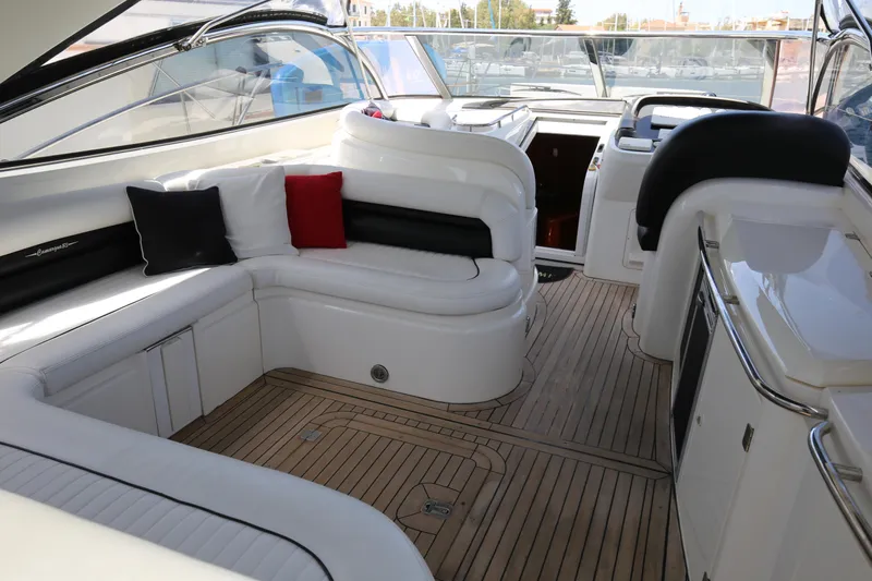  Yacht Photos Pics Luxurious 2001 Sunseeker Camargue 50 yacht interior with elegant seating and teak flooring.