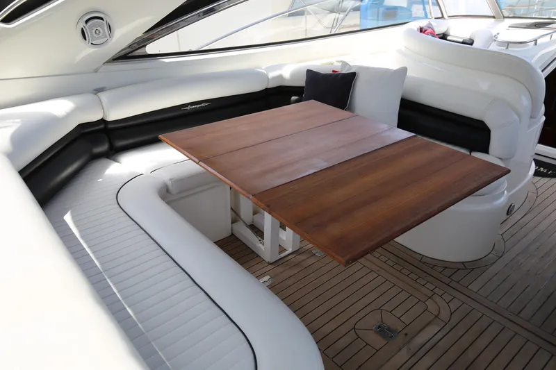  Yacht Photos Pics Luxurious Sunseeker Camargue 50 yacht interior with elegant seating and wooden table, 2001 model.