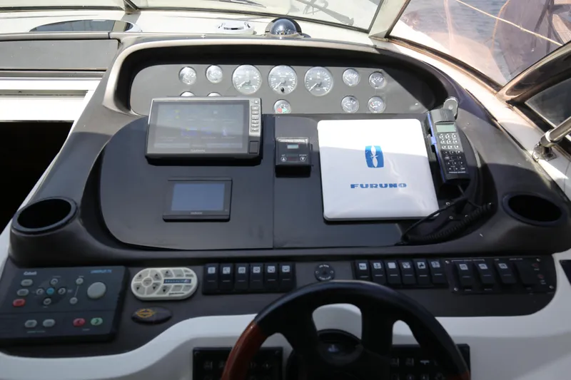  Yacht Photos Pics Helm of 2001 Sunseeker Camargue 50 with navigation equipment and controls.