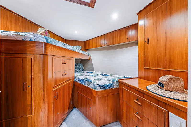 Reel Devocean Yacht Photos Pics 1990 Monterey Custom Sportfish cabin with wooden cabinetry and bunk beds.