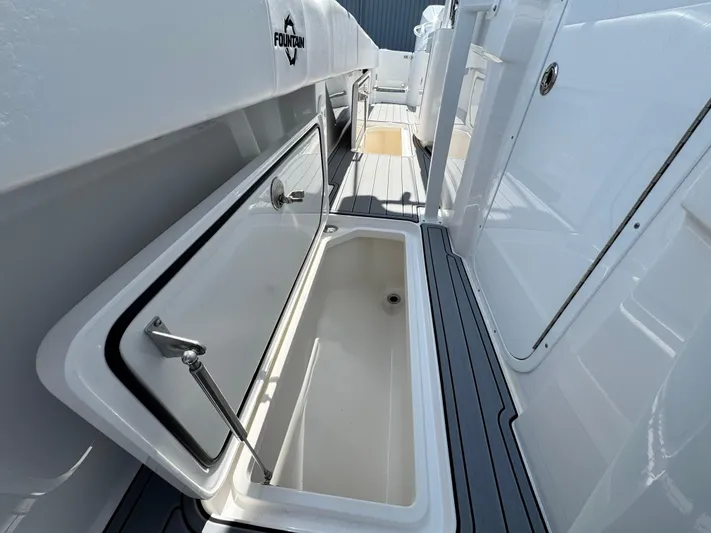  Yacht Photos Pics 2025 Fountain 34 TE boat interior with open storage compartment, sleek design.