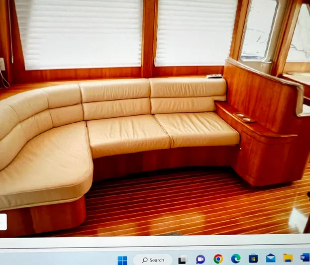 Edmond Dantes Yacht Photos Pics Luxurious 2004 Legacy Downeast yacht interior with leather seating and wooden flooring.