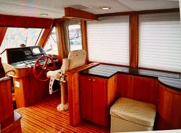 Edmond Dantes Yacht Photos Pics 2004 Legacy Downeast boat interior with wood finish and helm station.