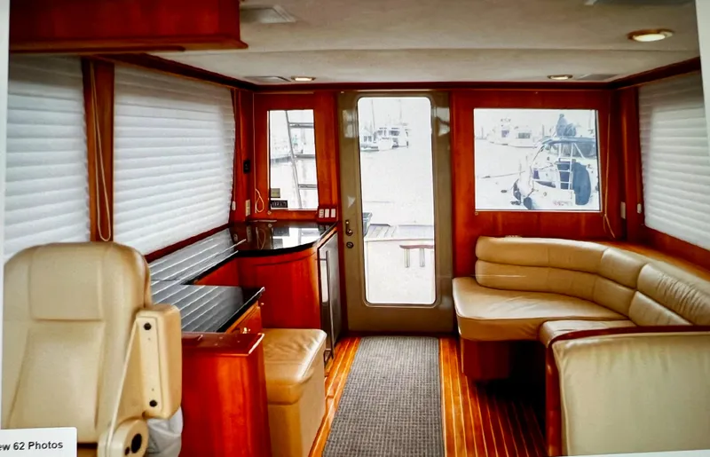 Edmond Dantes Yacht Photos Pics Interior of 2004 Legacy Downeast boat with leather seating and wood accents.