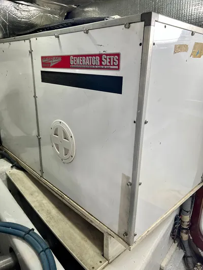 Edmond Dantes Yacht Photos Pics White generator set in a 2004 Legacy Downeast boat engine room.