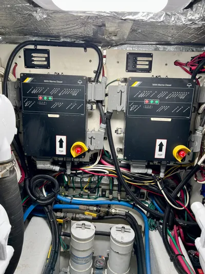 Edmond Dantes Yacht Photos Pics Engine room of a 2004 Legacy Downeast boat with electrical panels and wiring.