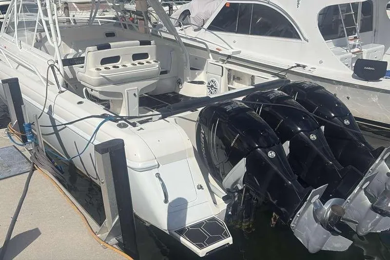  Yacht Photos Pics 2008 Intrepid 390 Sport Yacht with triple outboard engines docked at marina.