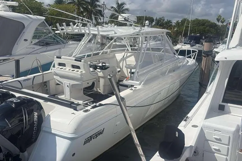  Yacht Photos Pics 2008 Intrepid 390 Sport Yacht docked, featuring sleek design and powerful Mercury engines.