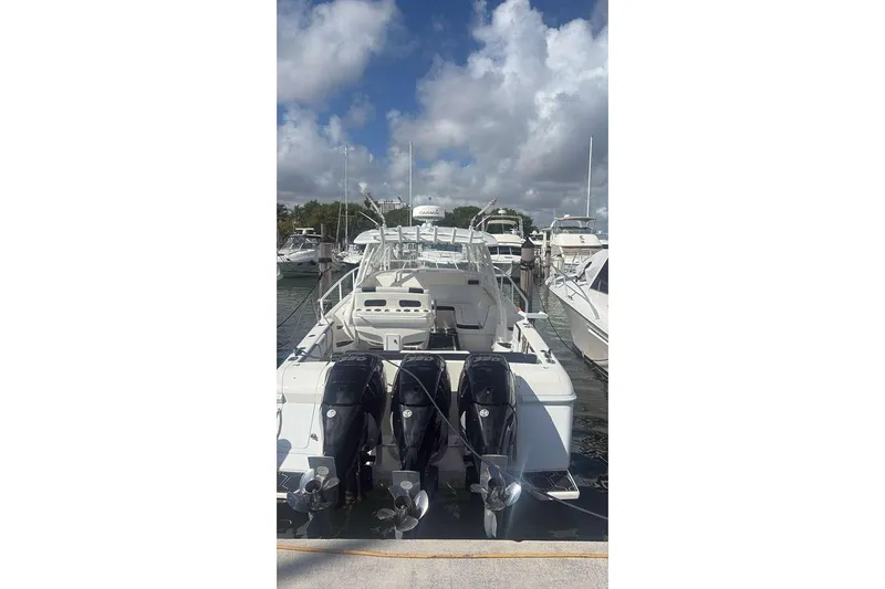  Yacht Photos Pics 2008 Intrepid 390 Sport Yacht docked with triple outboard engines.