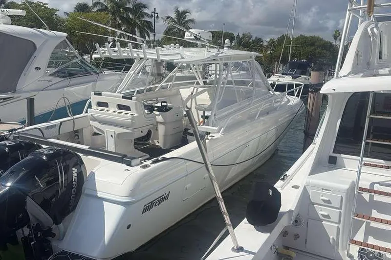  Yacht Photos Pics 2008 Intrepid 390 Sport Yacht docked, featuring sleek design and powerful Mercury engines.
