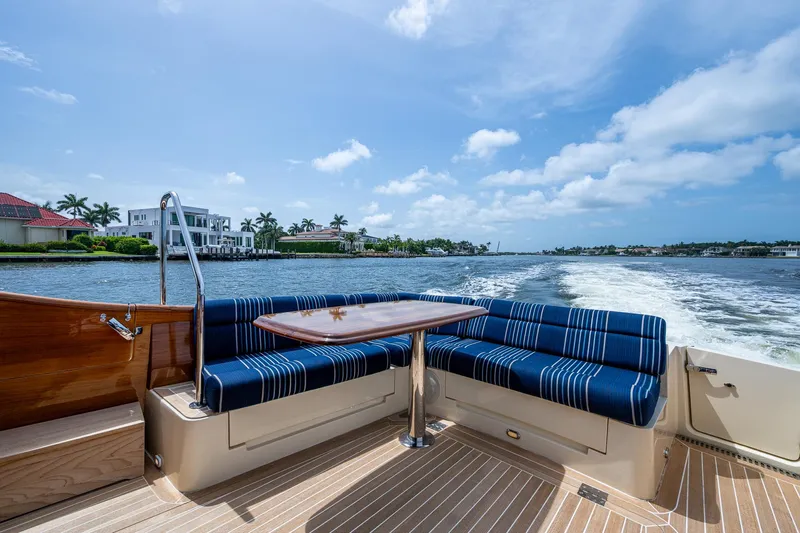  Yacht Photos Pics Hinckley Talaria 43 Motoryacht 2021, elegant seating area with waterfront view.