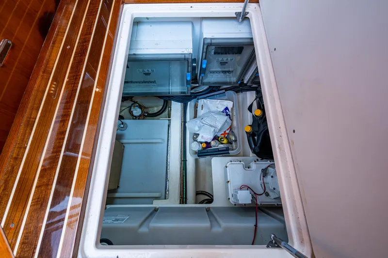  Yacht Photos Pics Engine compartment of 2021 Hinckley Talaria 43 Motoryacht, showcasing storage and mechanical components.