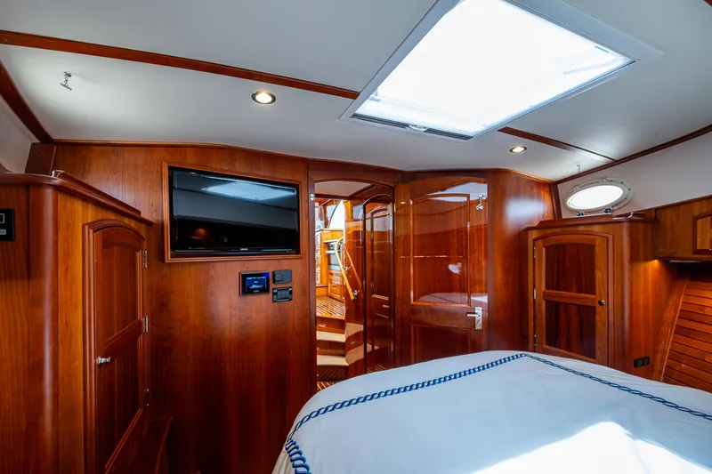  Yacht Photos Pics Luxurious interior of 2021 Hinckley Talaria 43 Motoryacht with wood finish and modern amenities.