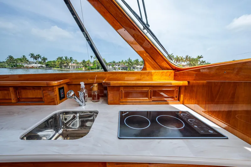  Yacht Photos Pics Luxurious 2021 Hinckley Talaria 43 Motoryacht interior with sleek kitchen and scenic view.
