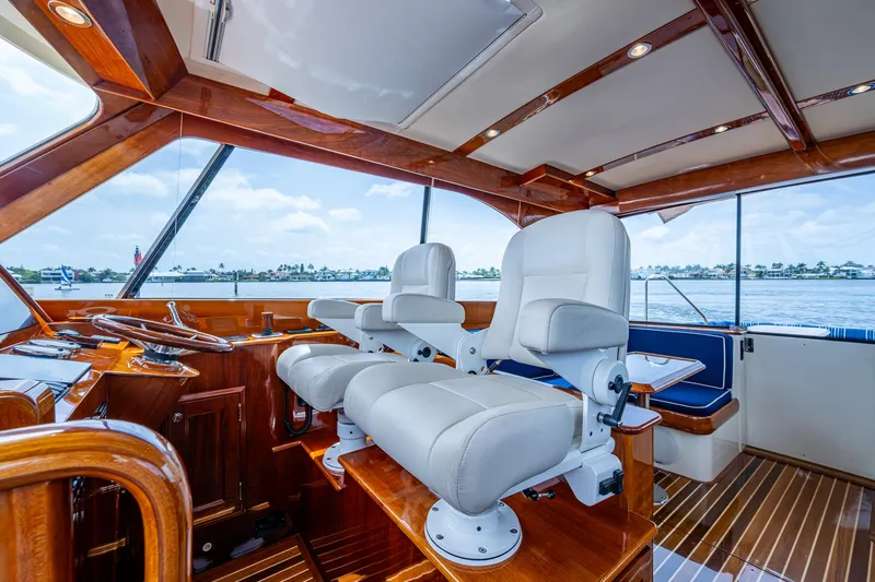  Yacht Photos Pics Luxurious interior of 2021 Hinckley Talaria 43 Motoryacht with plush seating and wooden accents.