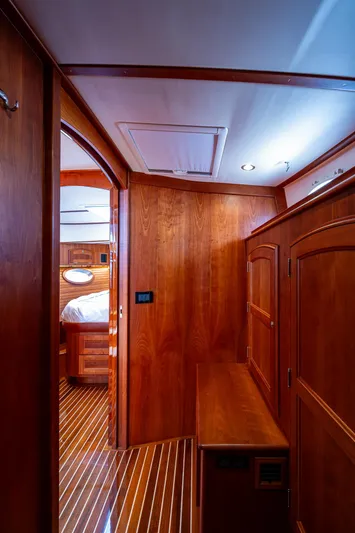  Yacht Photos Pics Interior of 2021 Hinckley Talaria 43 Motoryacht, featuring elegant wood paneling and cabinetry.