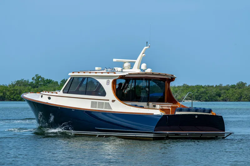  Yacht Photos Pics 2021 Hinckley Talaria 43 Motoryacht cruising on calm waters.