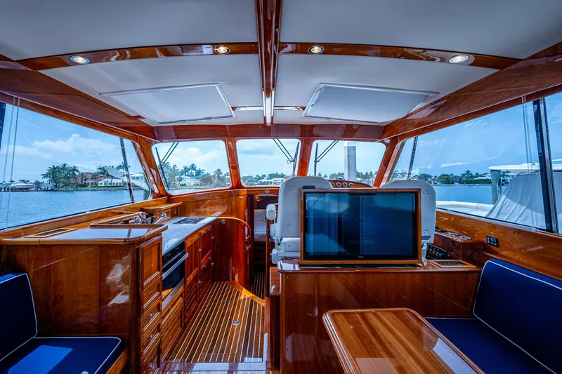  Yacht Photos Pics Luxurious interior of 2021 Hinckley Talaria 43 Motoryacht with polished wood finish and scenic views.