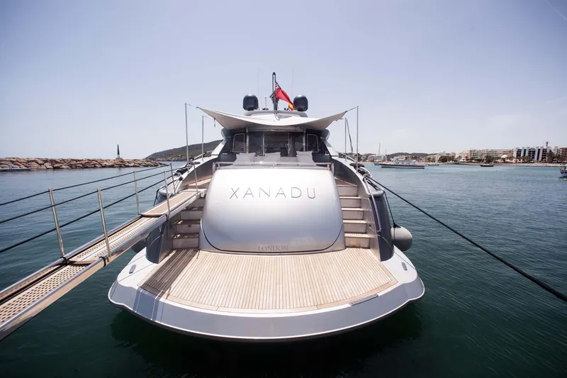  Yacht Photos Pics Luxury Canados 90 yacht, 2010 model, docked at a marina with clear skies.