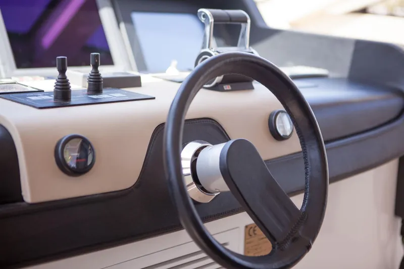  Yacht Photos Pics Steering wheel and controls of a 2010 Canados 90 yacht.