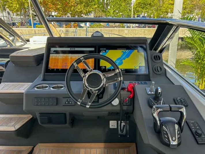  Yacht Photos Pics 2024 Windy 40 Camira SX helm with dual navigation screens and modern controls.