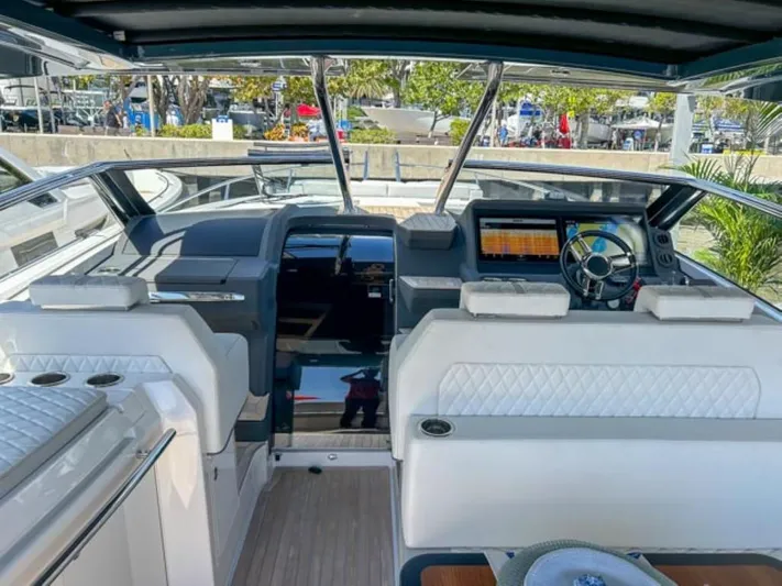  Yacht Photos Pics 2024 Windy 40 Camira SX boat interior with modern dashboard and white seating.