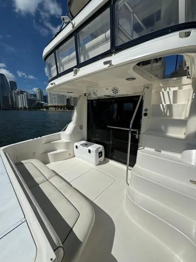  Yacht Photos Pics 2005 Sea Ray 58 Sedan Bridge yacht with spacious deck and city skyline view.