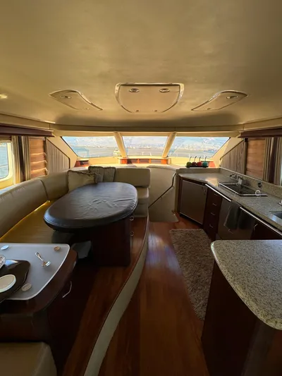  Yacht Photos Pics Luxurious interior of a 2005 Sea Ray 58 Sedan Bridge yacht with elegant dining area.