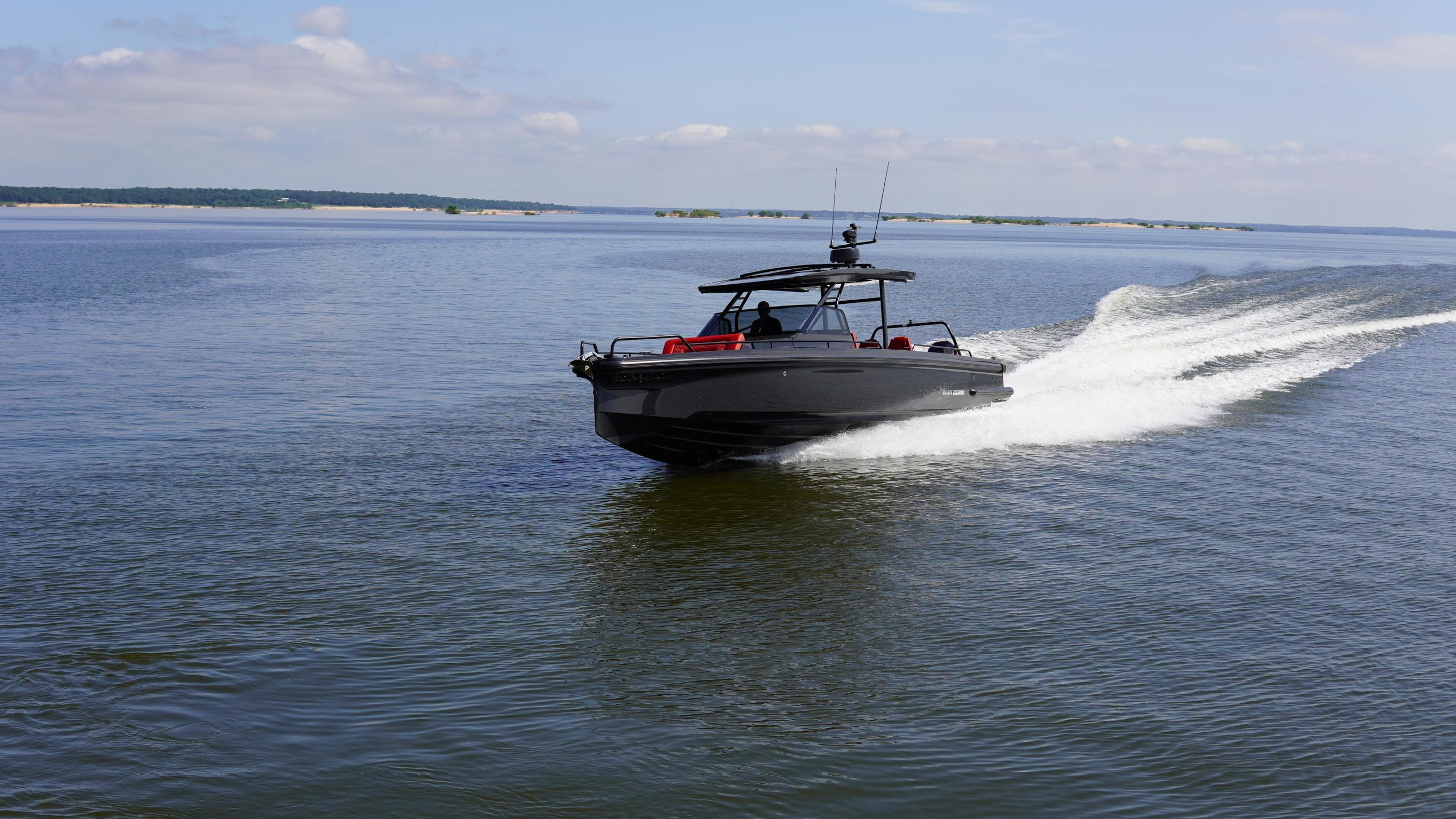 2020 BRABUS Shadow 900 Sun Top cruising on open water, showcasing sleek design and speed.
