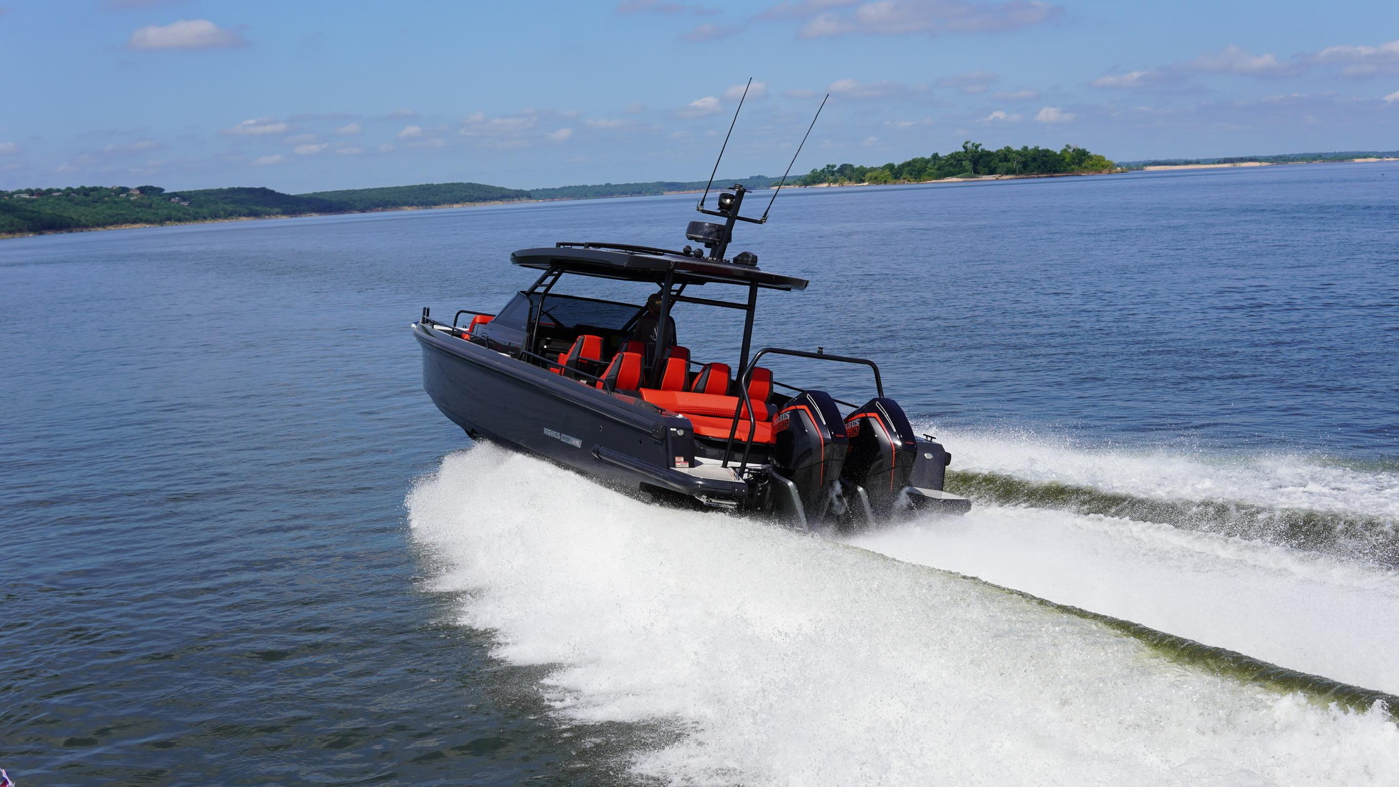 BRABUS Shadow 900 Sun Top 2020 speeding on a lake with red seating.