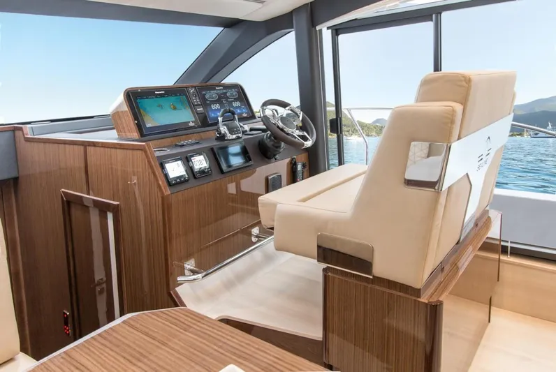  Yacht Photos Pics 2024 Sealine F430 yacht interior with modern helm and luxurious seating.
