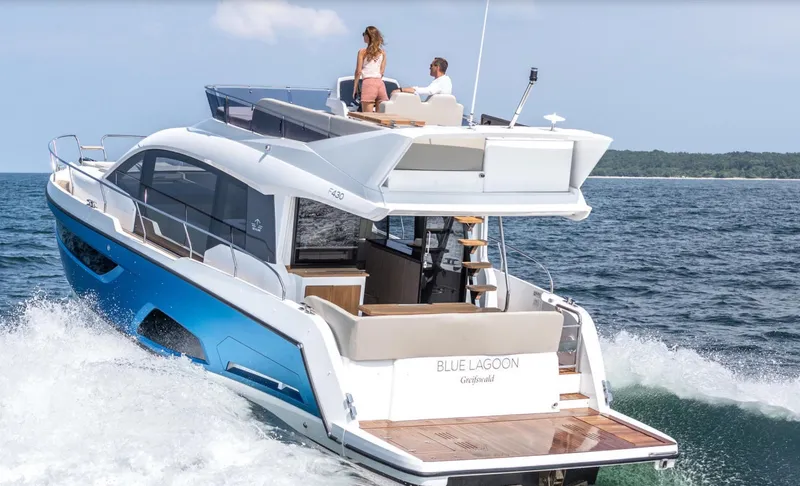  Yacht Photos Pics 2024 Sealine F430 yacht cruising on open water with passengers enjoying the view.