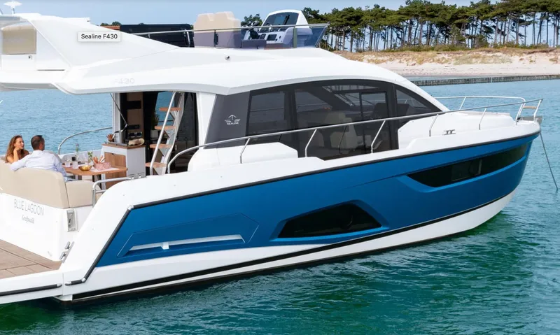  Yacht Photos Pics 2024 Sealine F430 yacht cruising on blue water, featuring sleek design and modern amenities.
