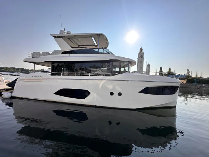 Skyfall Yacht Photos Pics Luxury yacht Absolute 52 Navetta 2022 in harbor at sunrise.
