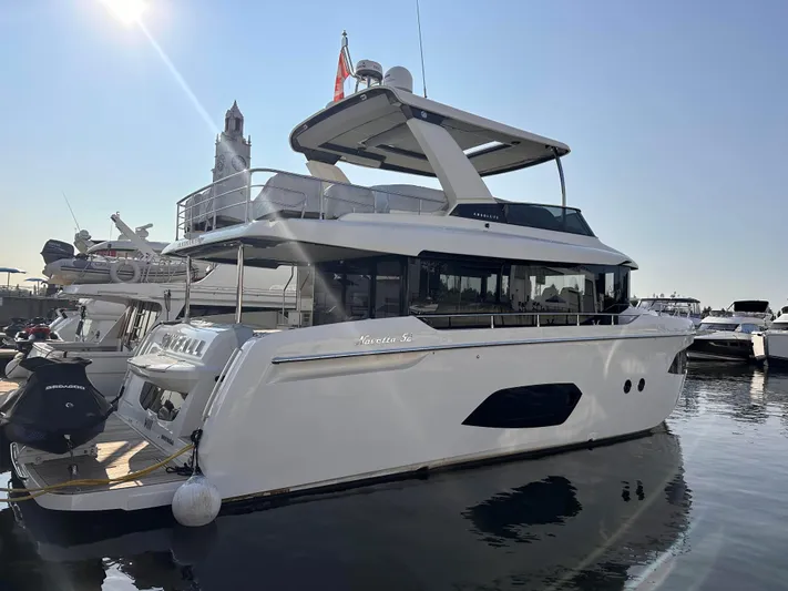 Skyfall Yacht Photos Pics Luxury yacht Absolute 52 Navetta 2022 docked in sunny harbor.