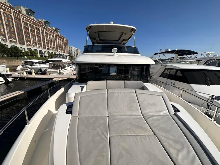 Skyfall Yacht Photos Pics Absolute 52 Navetta 2022 yacht docked, front view with sunbed.