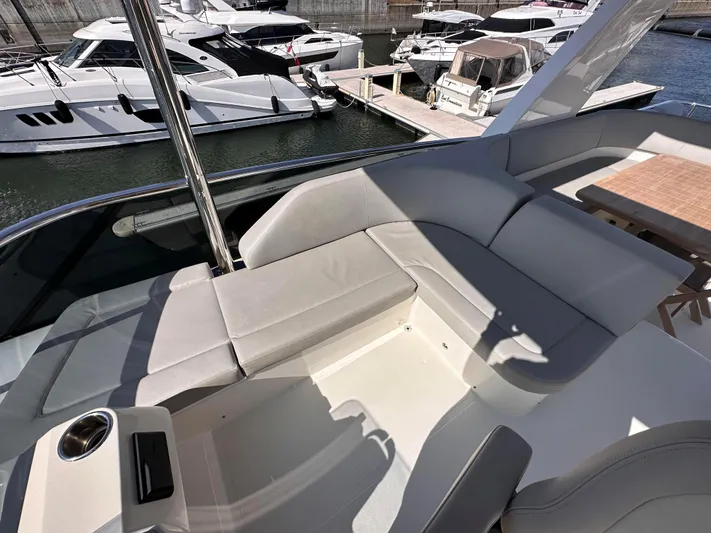 Skyfall Yacht Photos Pics Luxurious deck of Absolute 52 Navetta yacht, 2022 model, docked in marina.