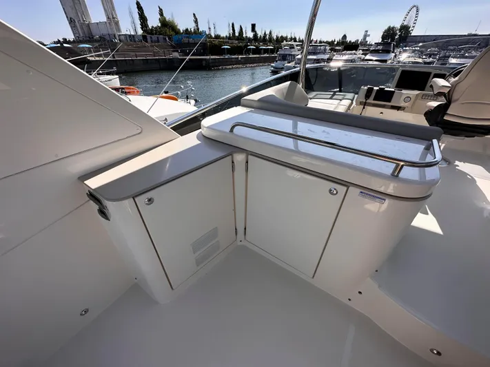 Skyfall Yacht Photos Pics Absolute 52 Navetta 2022 yacht with modern deck features in harbor.