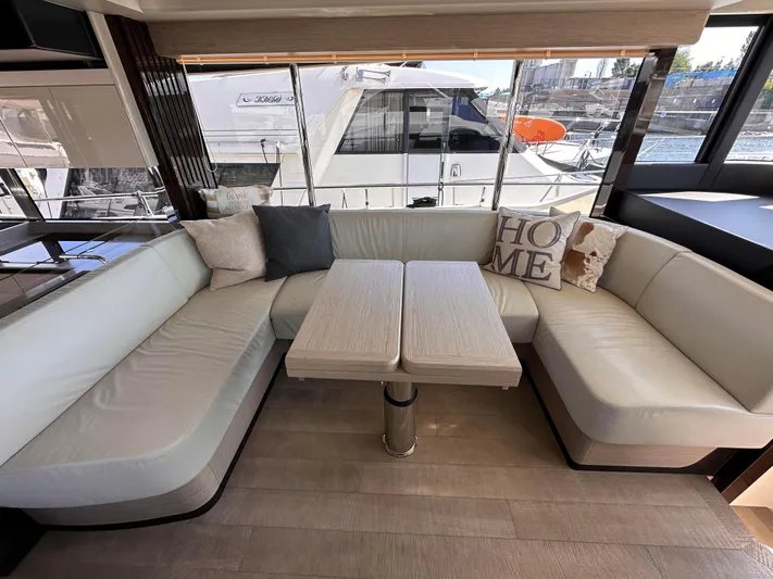 Skyfall Yacht Photos Pics Interior of Absolute 52 Navetta 2022 with elegant seating area.