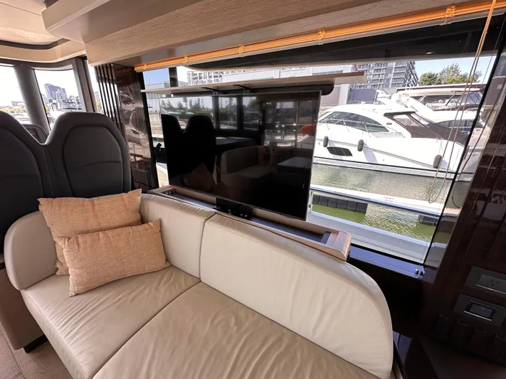 Skyfall Yacht Photos Pics Interior of Absolute 52 Navetta 2022 with sofa and TV.